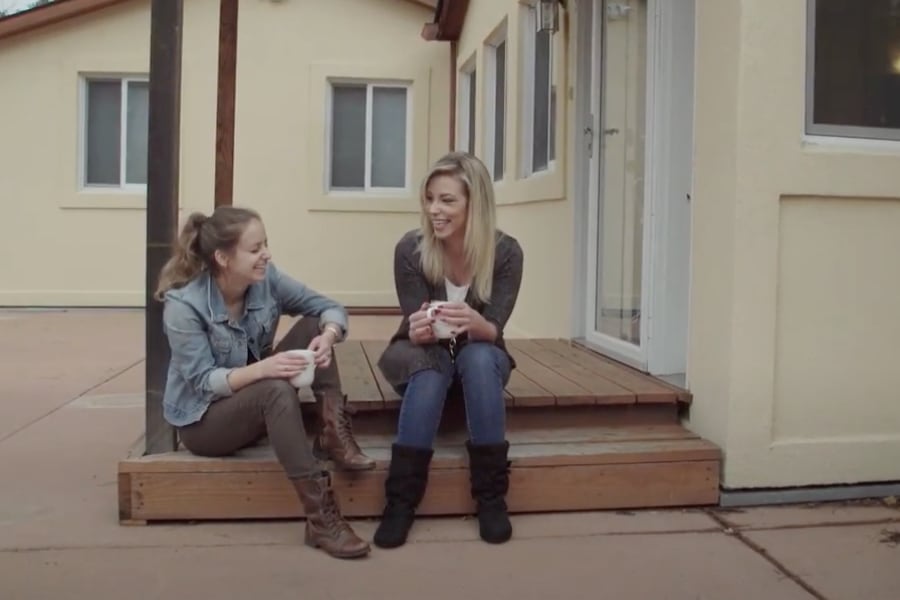 two women outside house