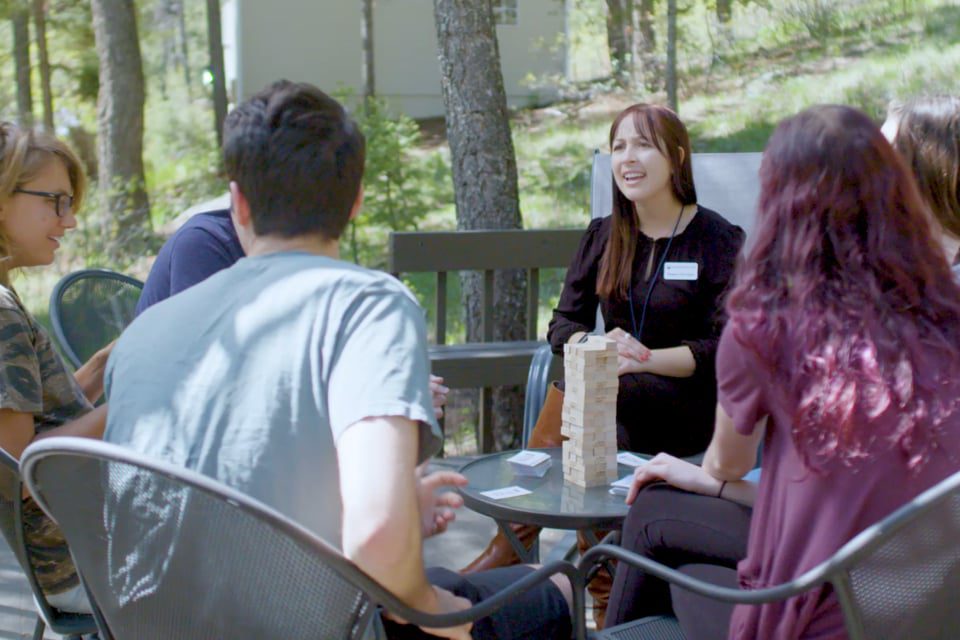 Teens hanging out at an outdoor sitting area at teen rehab