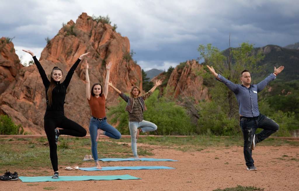 Outdoor yoga group activity with instructor at Colorado teen rehab