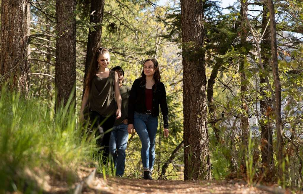 Teens on outdoor trail hike