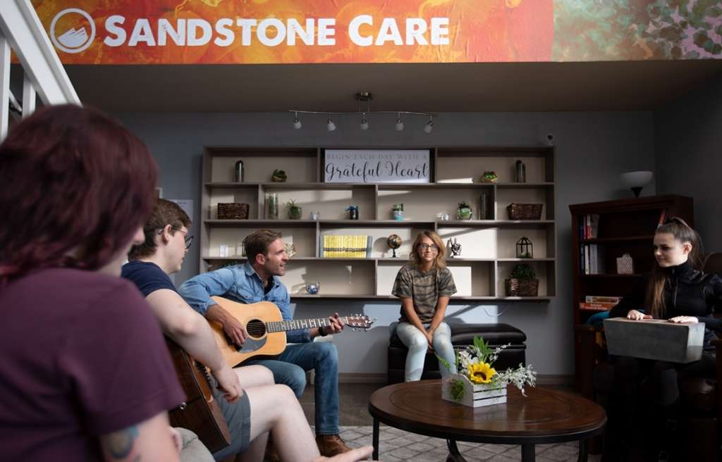 Group music therapy session at Colorado teen rehab