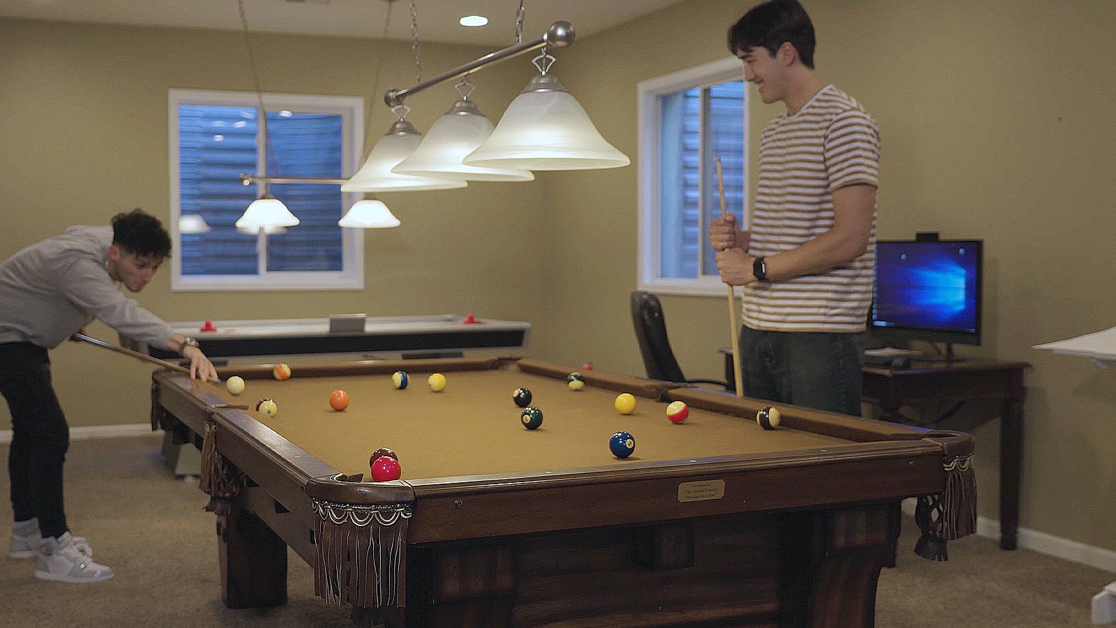 Two men playing pool.