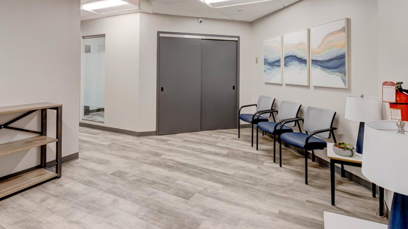 a view of a waiting room with chairs and a table