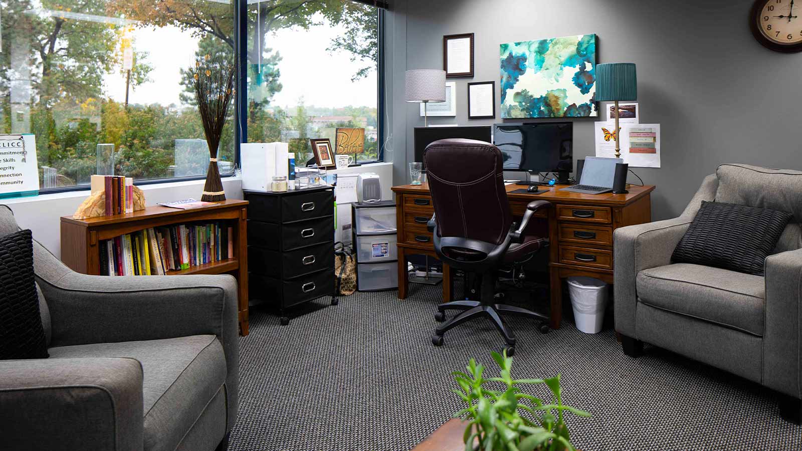 there is a room with a desk, chair, and a computer