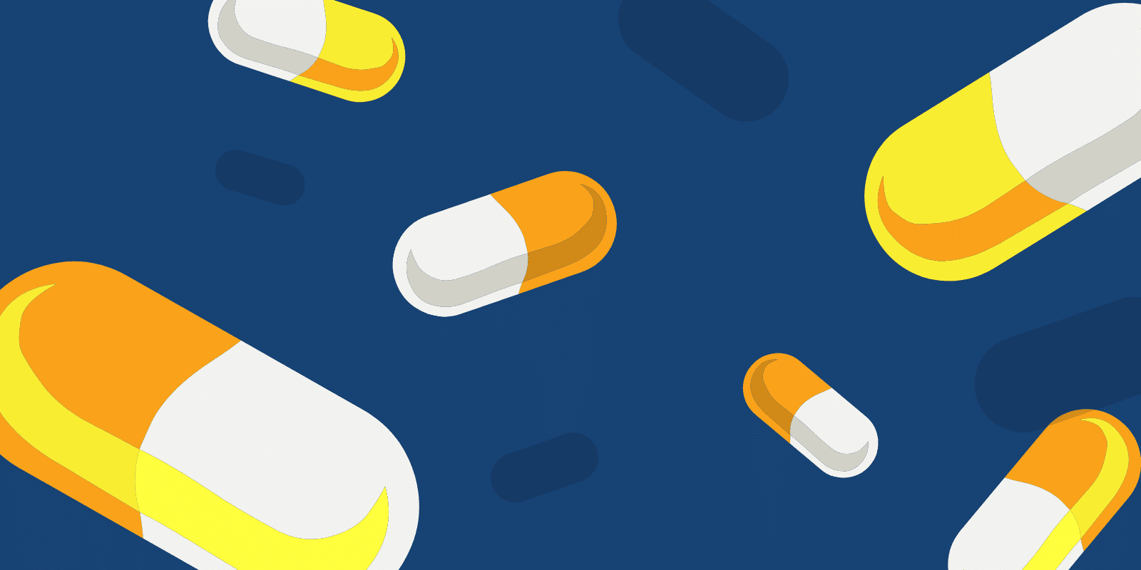 Yello and Orange capsules on a navy background with shadows