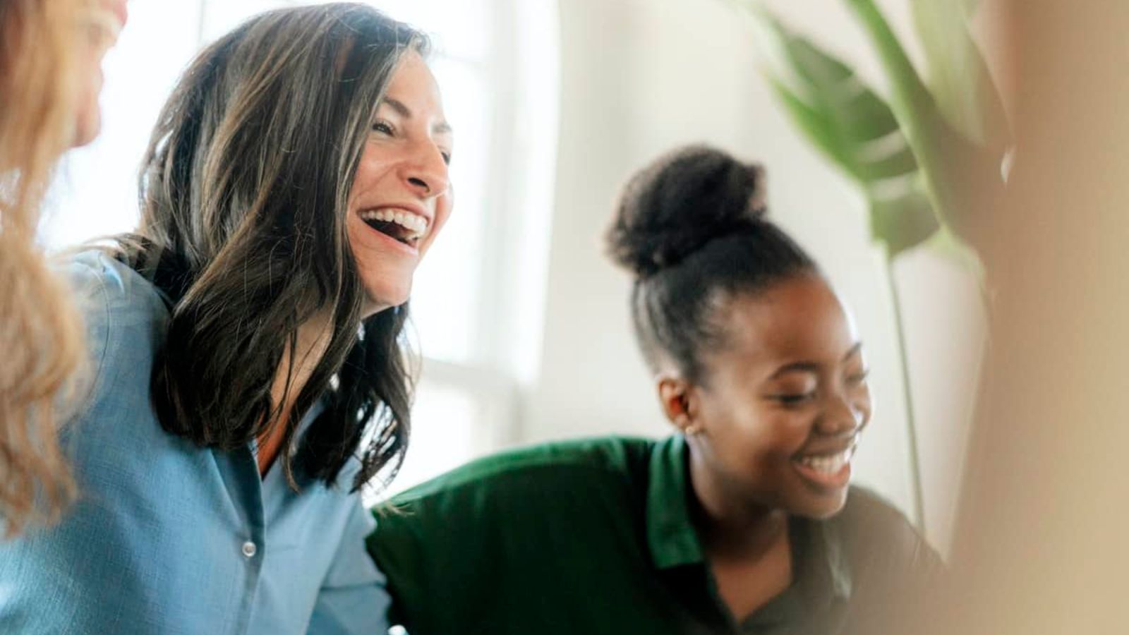 People sitting and smiling in group therapy