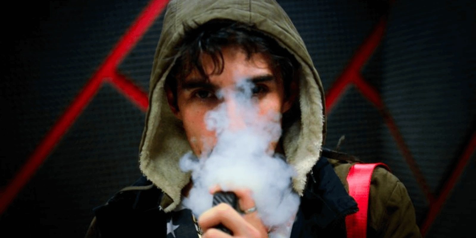 A male teen vaping