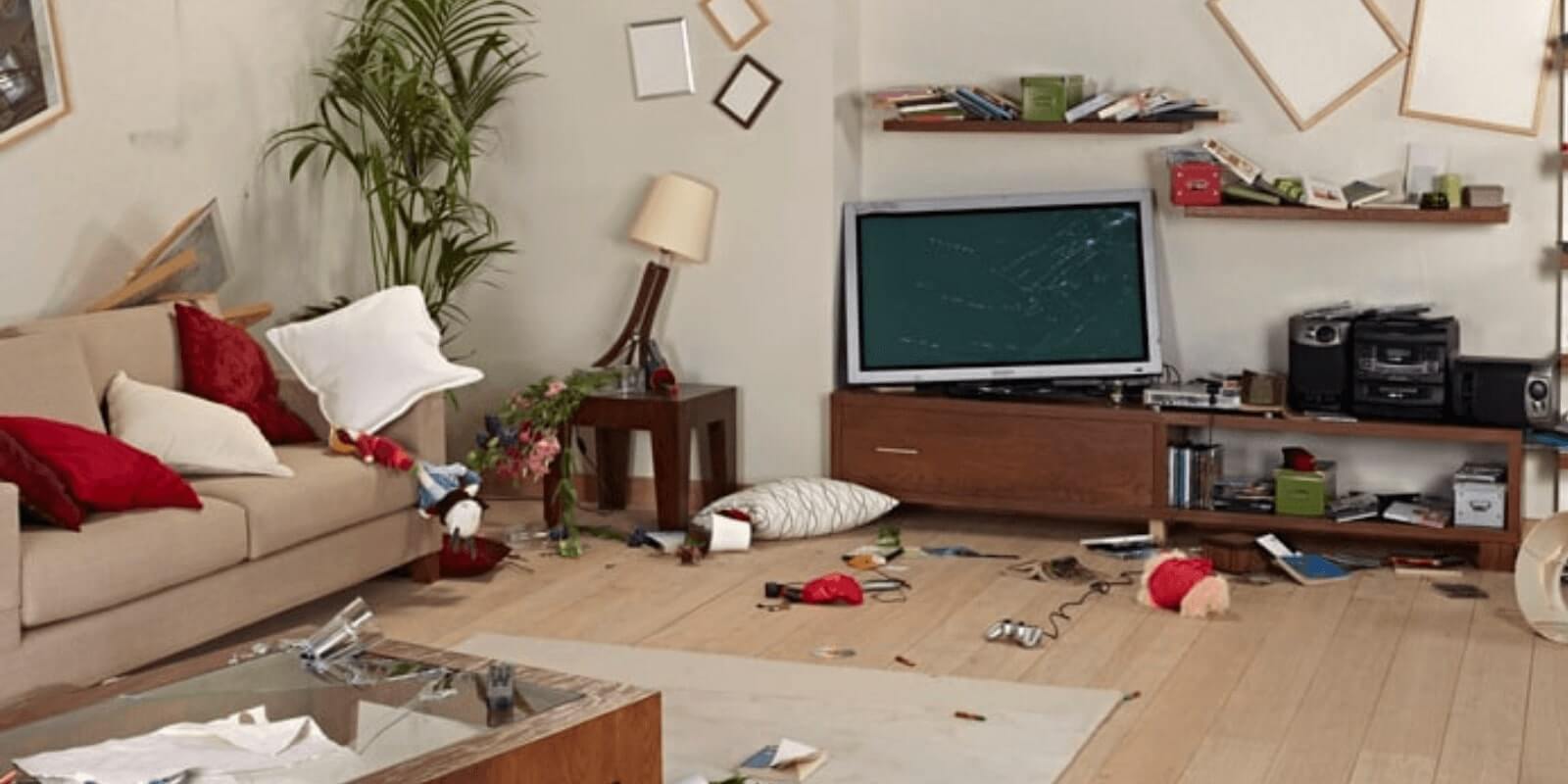 living room that has a broken tv and broken items all over the floor