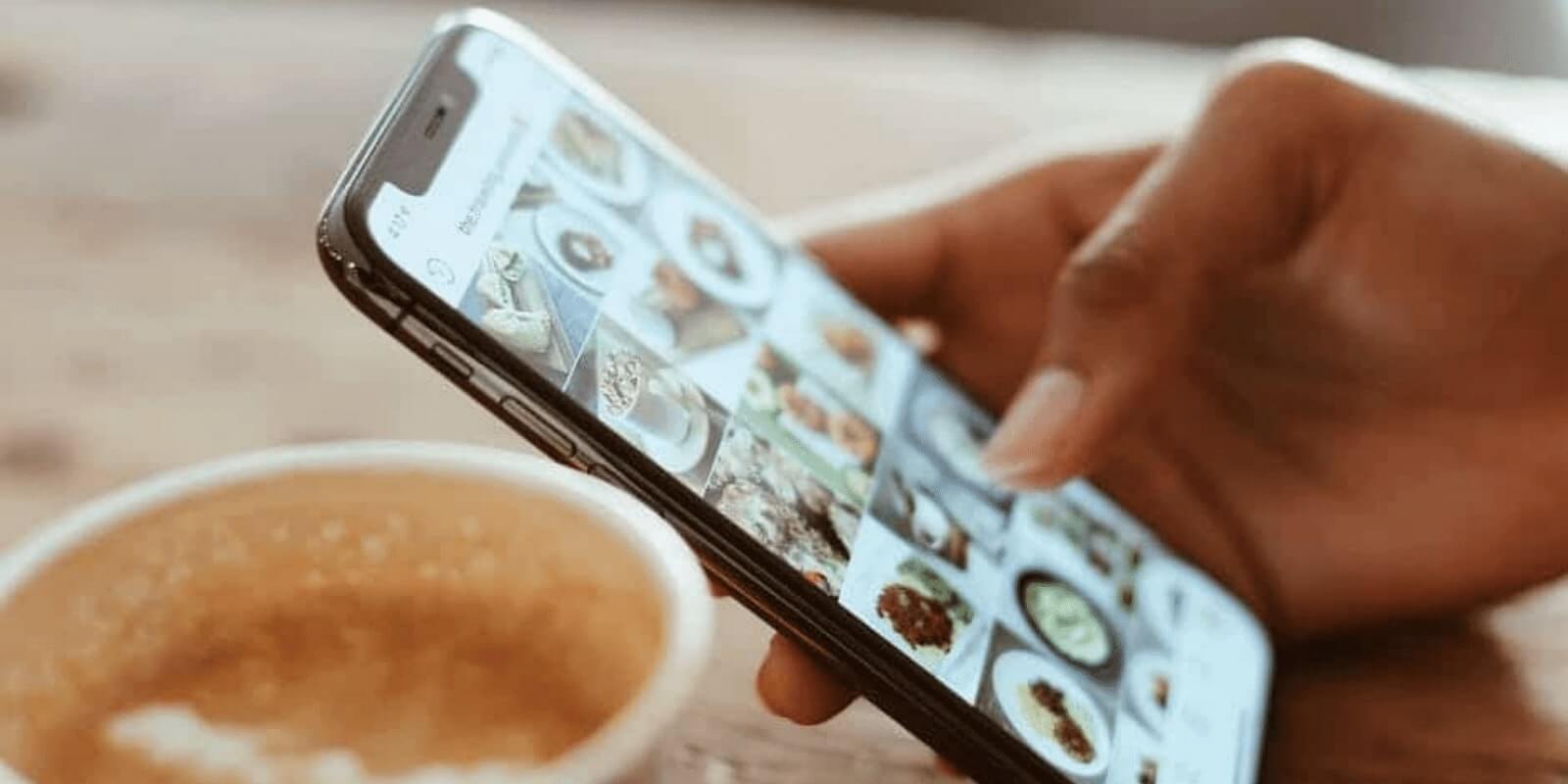 Person looking of phone at coffee shop