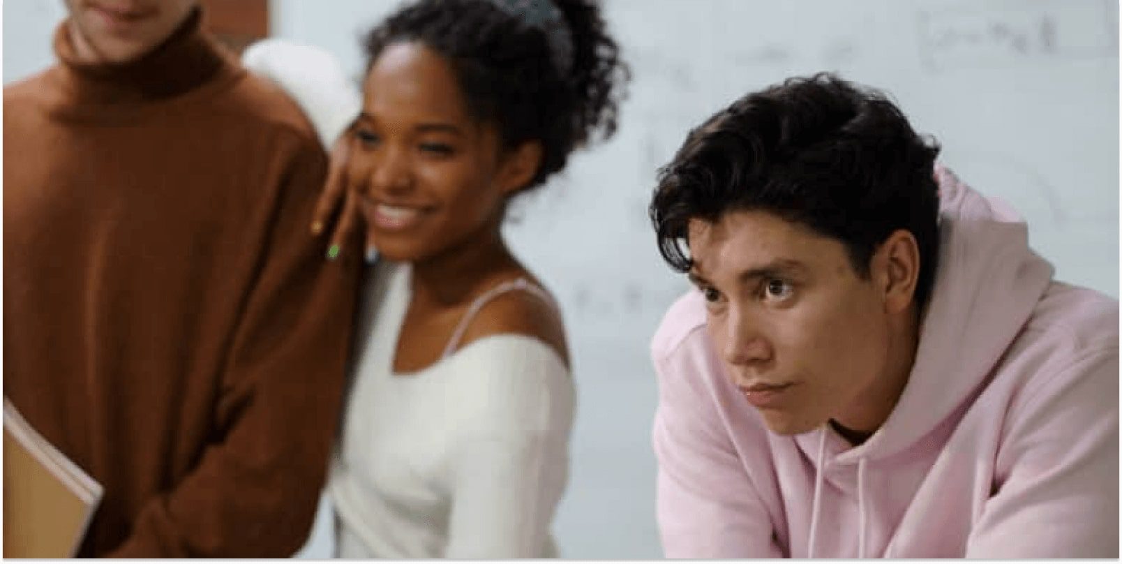 A group of teens in a classroom