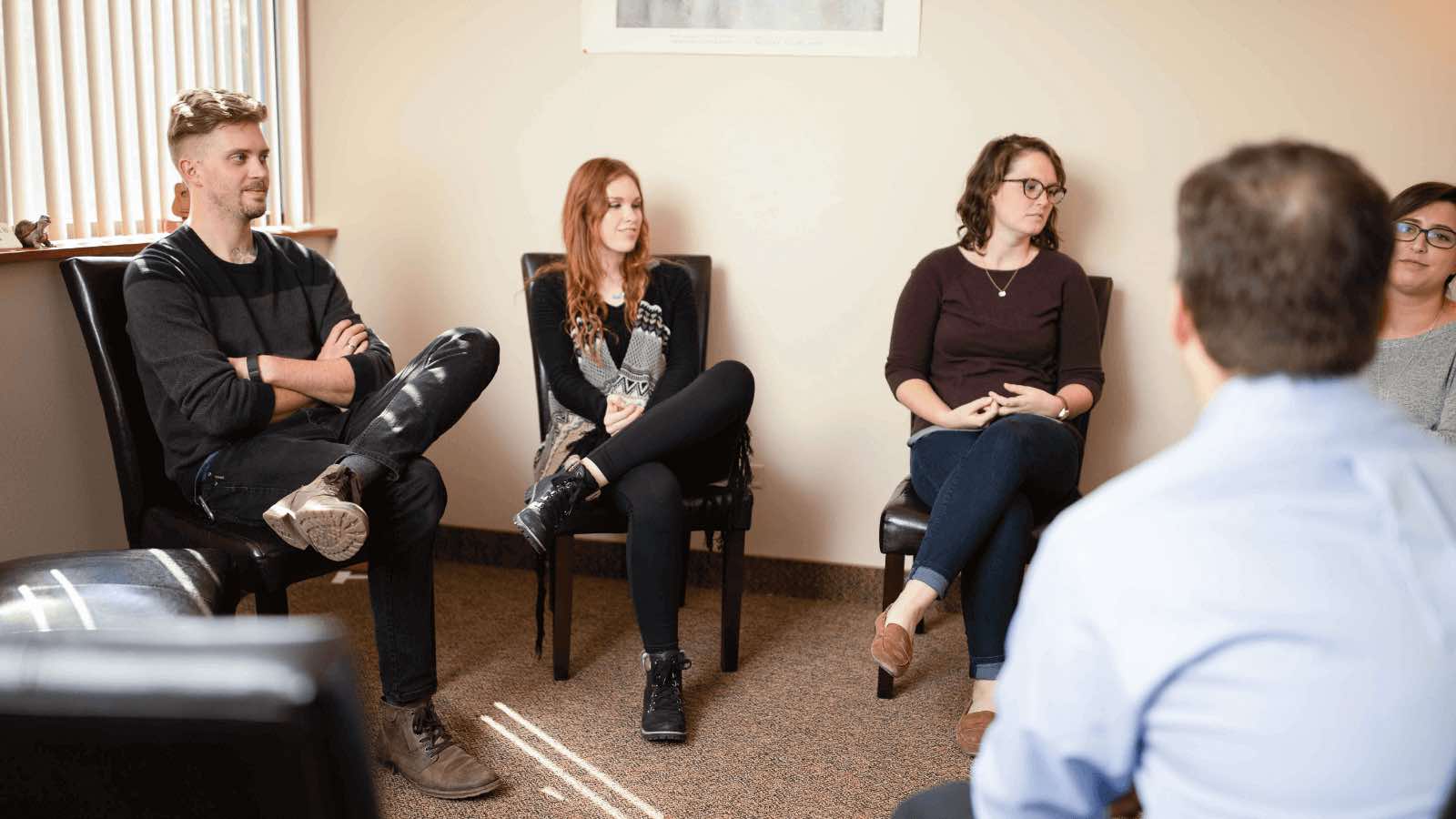 Towson mental health center's group therapy session with people sitting in a circle