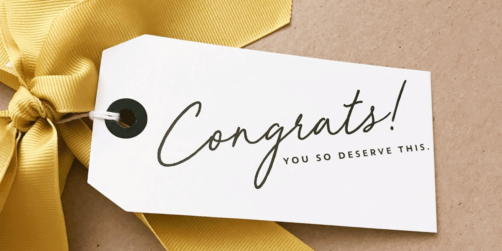Gift box with "Congrats you so deserve this" card