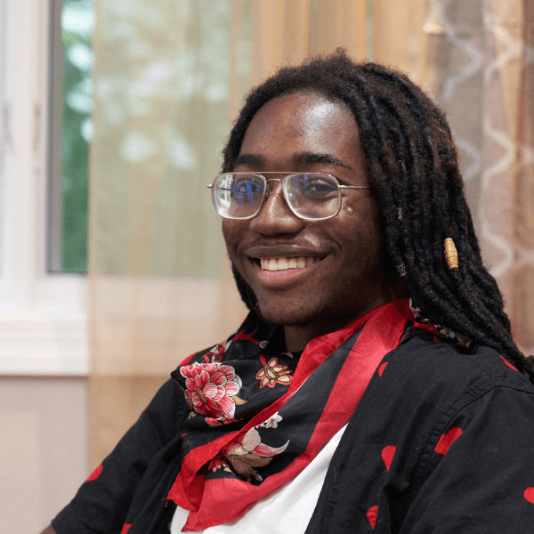 young adult male smiling in therapy