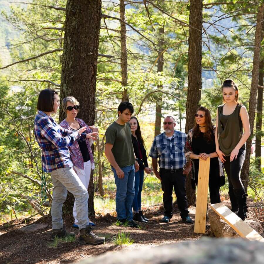 Young people standing by trees