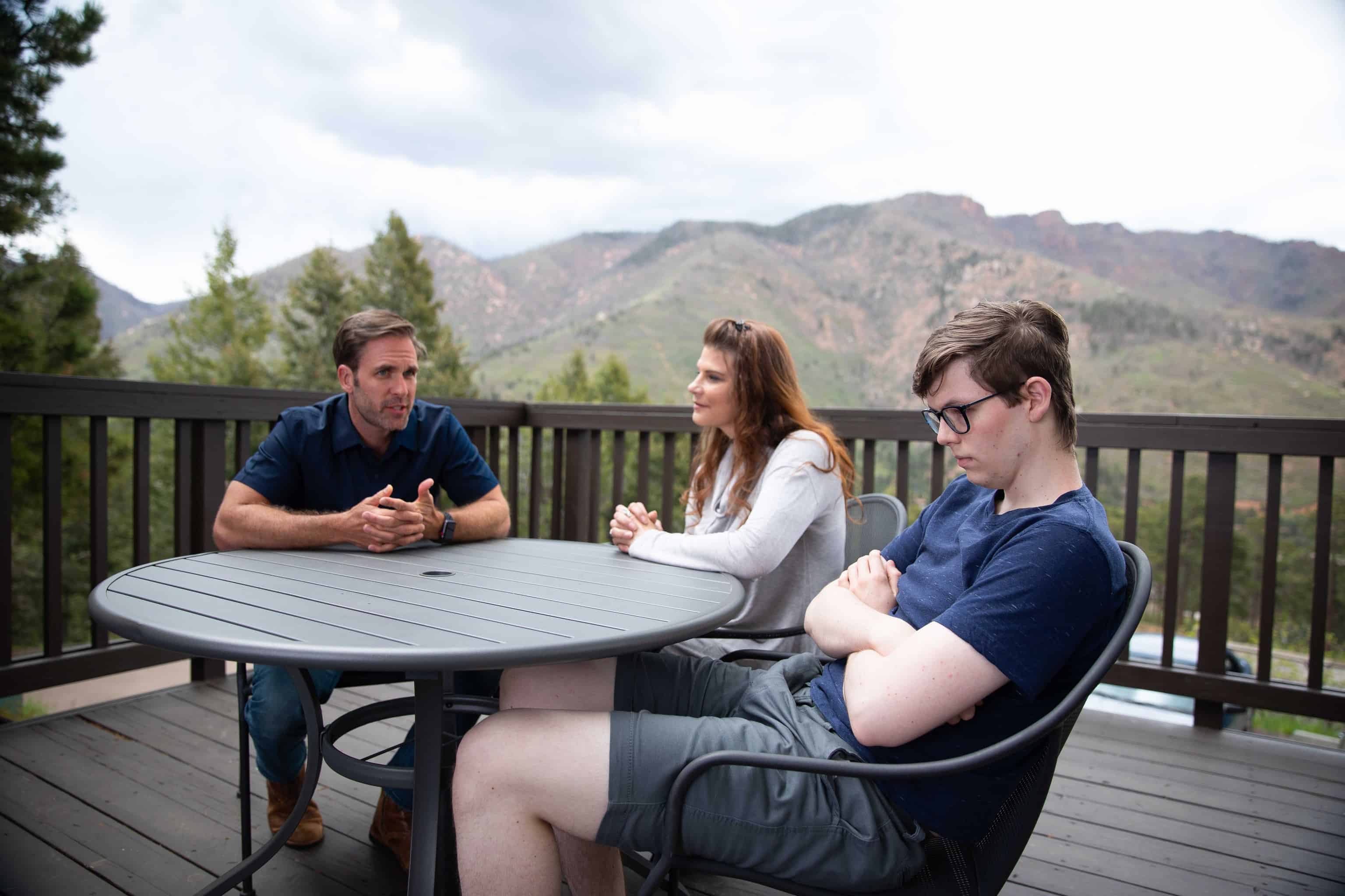 parents-having-conversation-with-teen-son