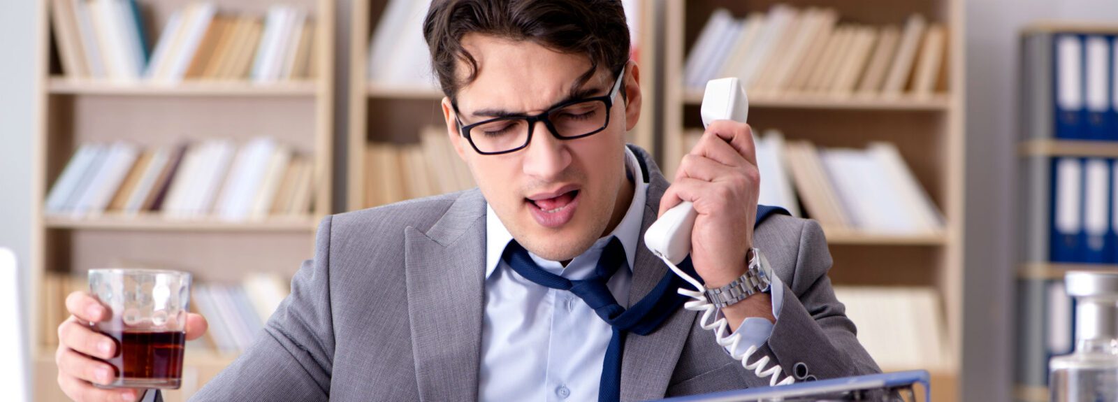 young business man working and drinking