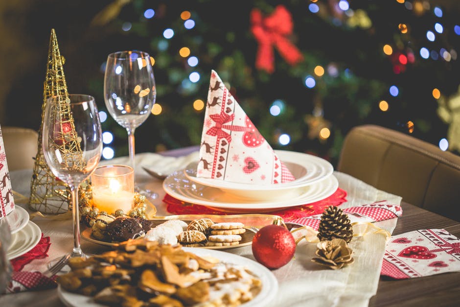 a close up of a table with plates and glasses on it