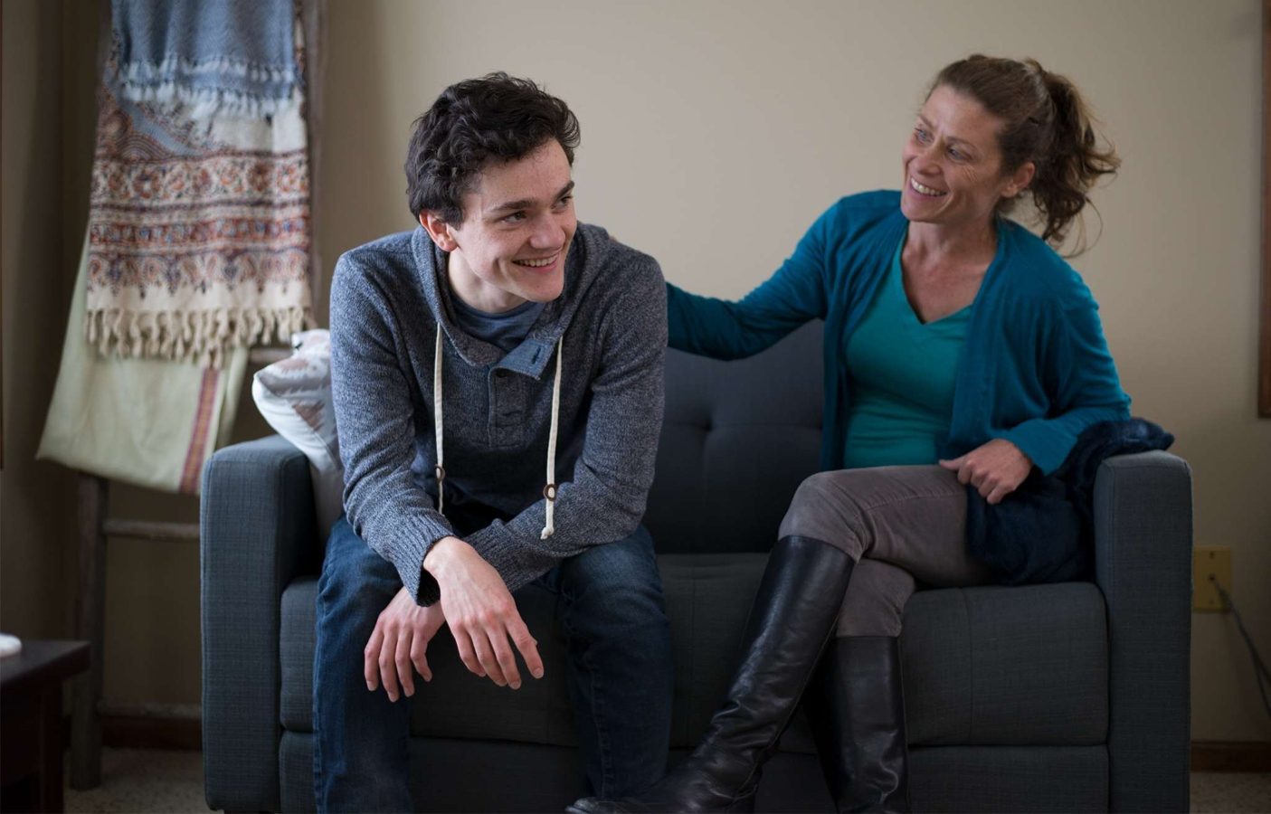 A teen in therapy talking with their parent