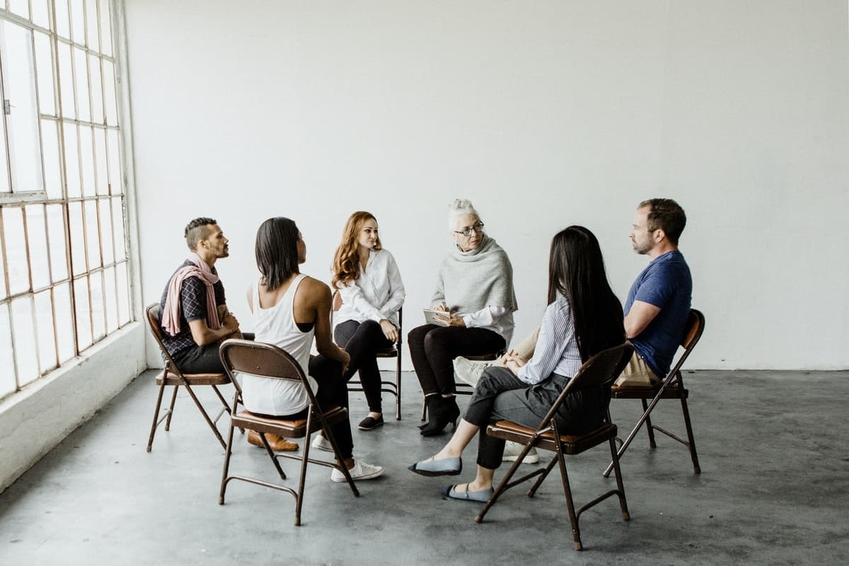 Diverse people in a supporting group session