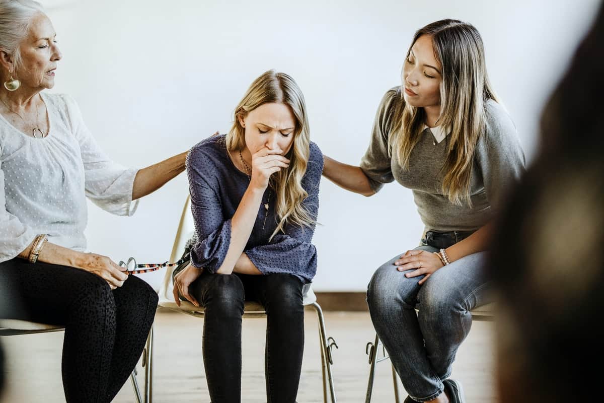 Diverse people in a supporting group session