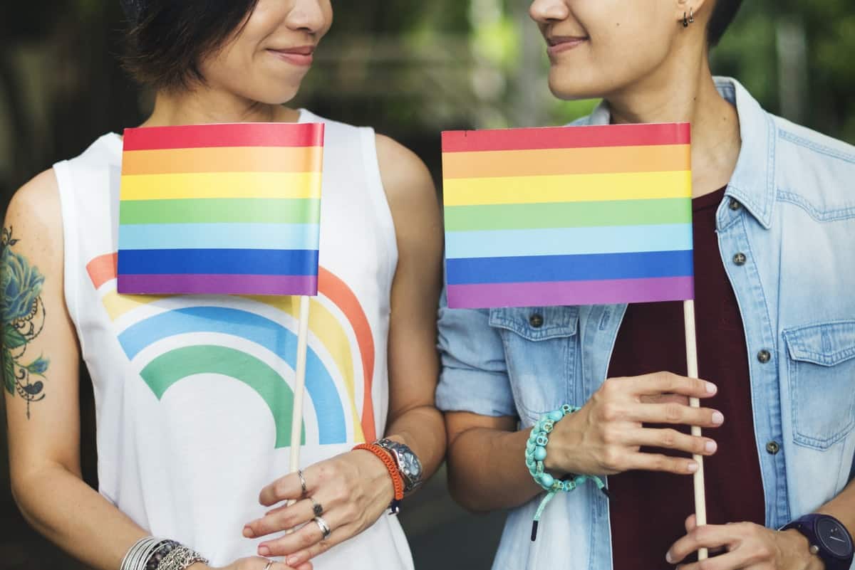 lgbtqia-people-holding-flag