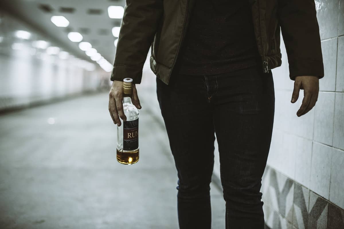 woman-holding-bottle-of-alcohol