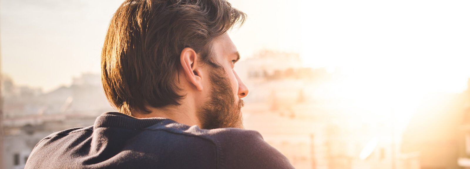 middle age man looking toward light, outdoor