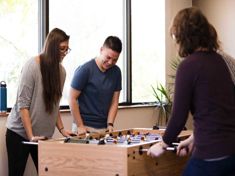 patients playing foosball