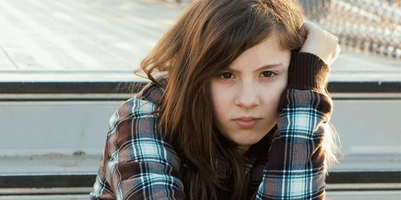 A teen girl staring at the camera