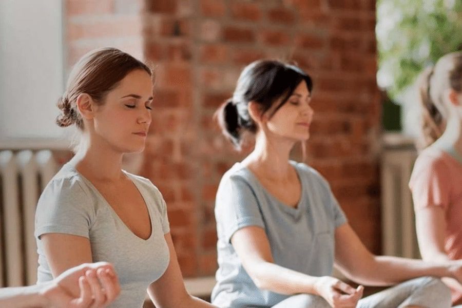 Women practicing meditation