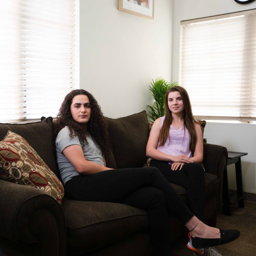 Young Women Sitting on a Couch