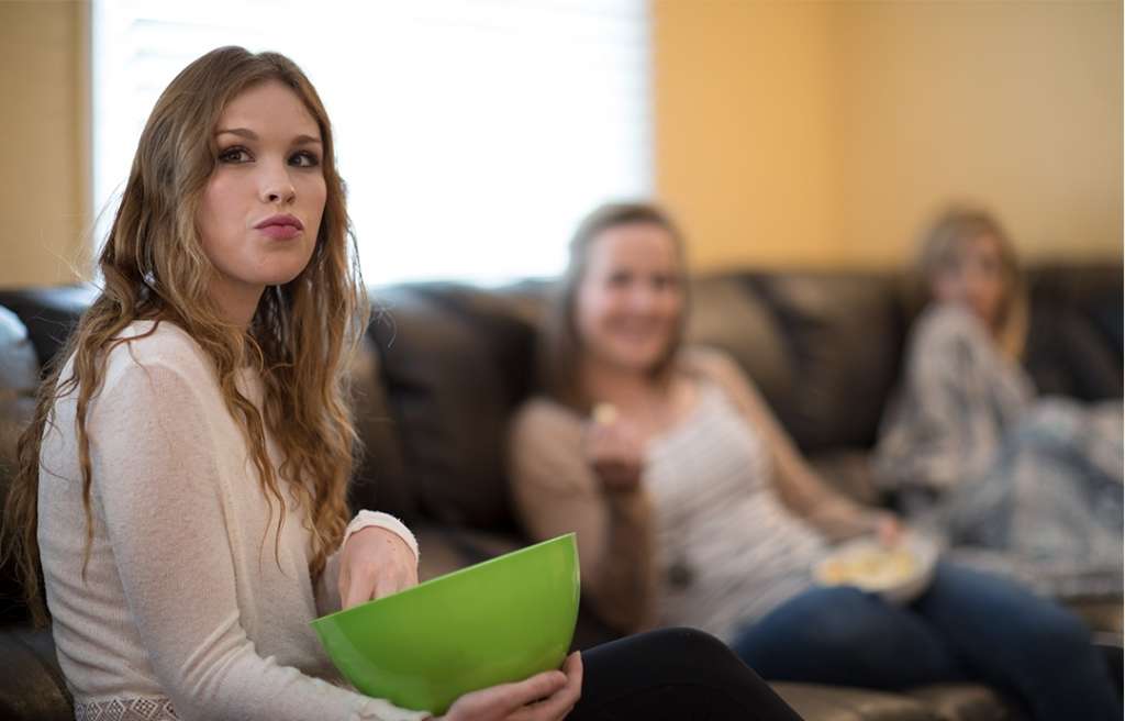 Young adult women sitting on a sofa