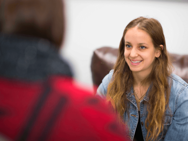 Teen smiling at a therapist