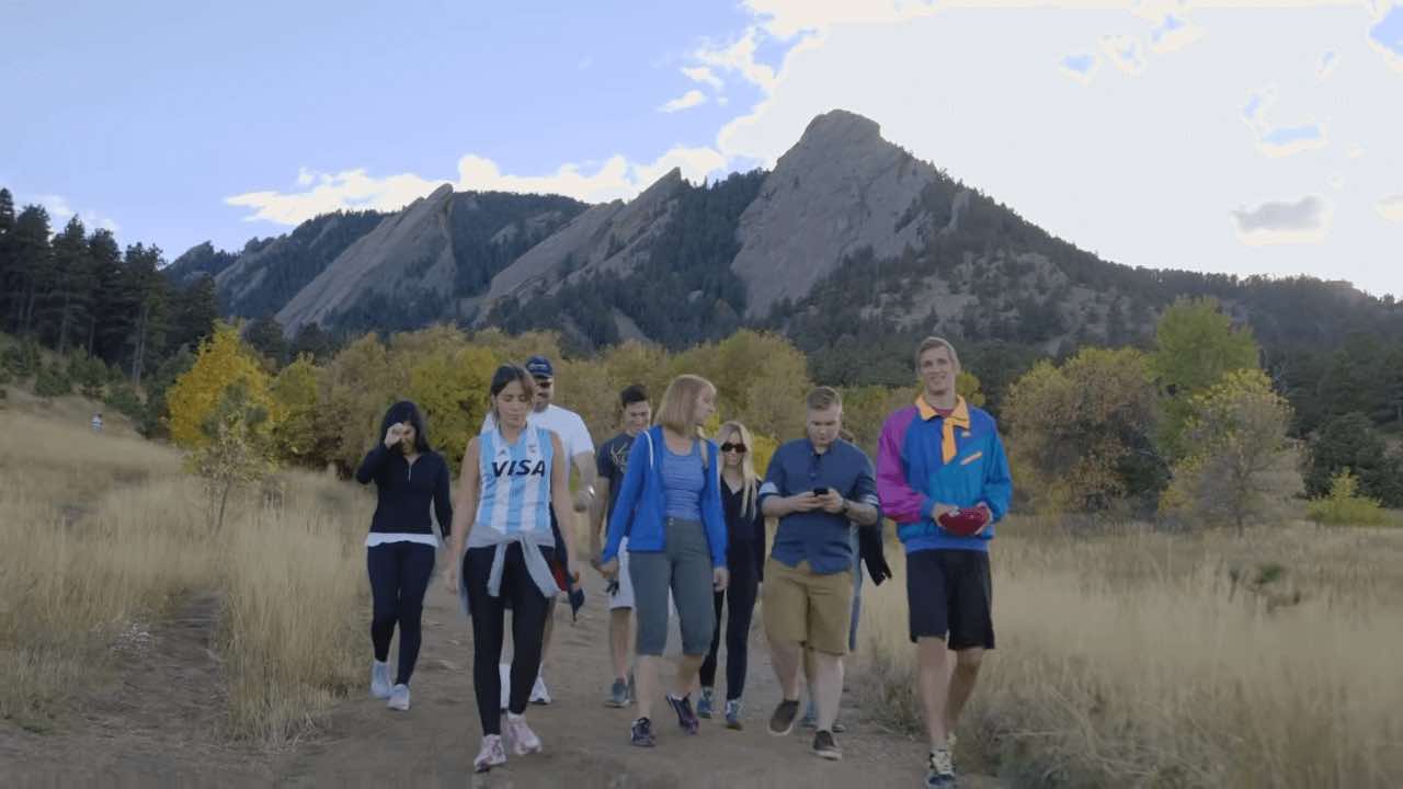 Group of teens going on a hike while led by a therapist