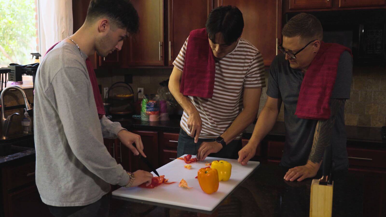 men in transitional living who are learning life skills like cooking.