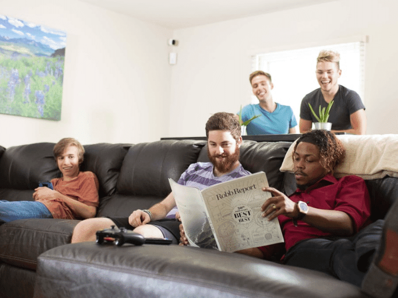 Young adults hanging out in the living room