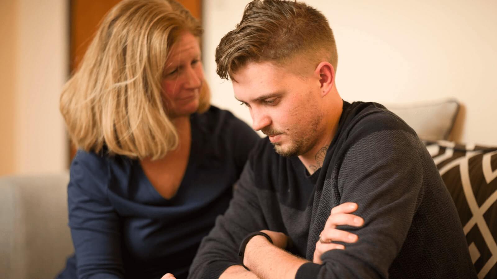 Mom consoling her son