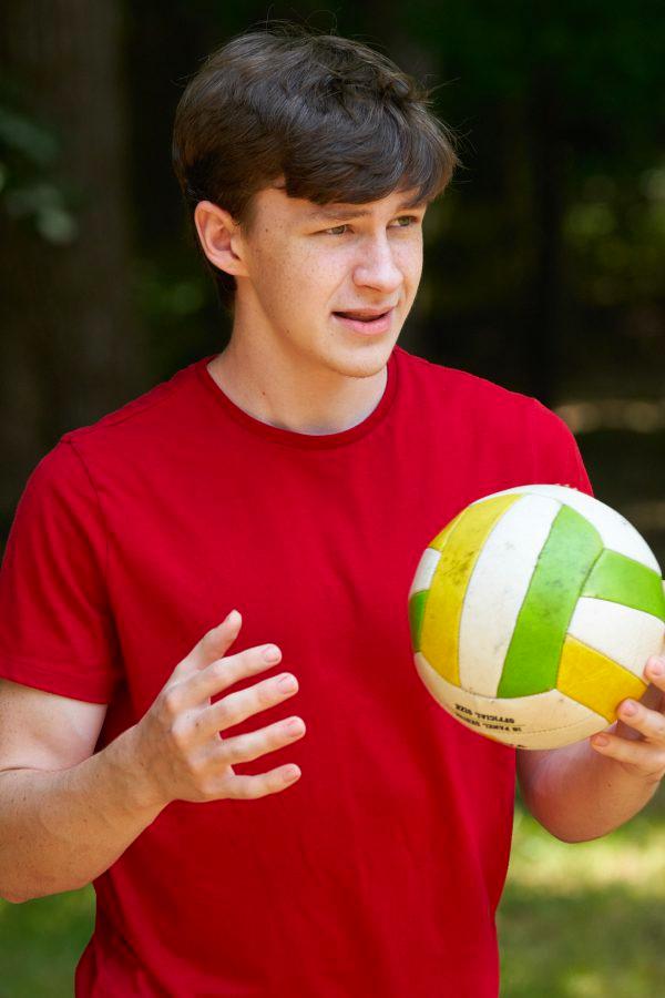 Teen boy holding soccer ball