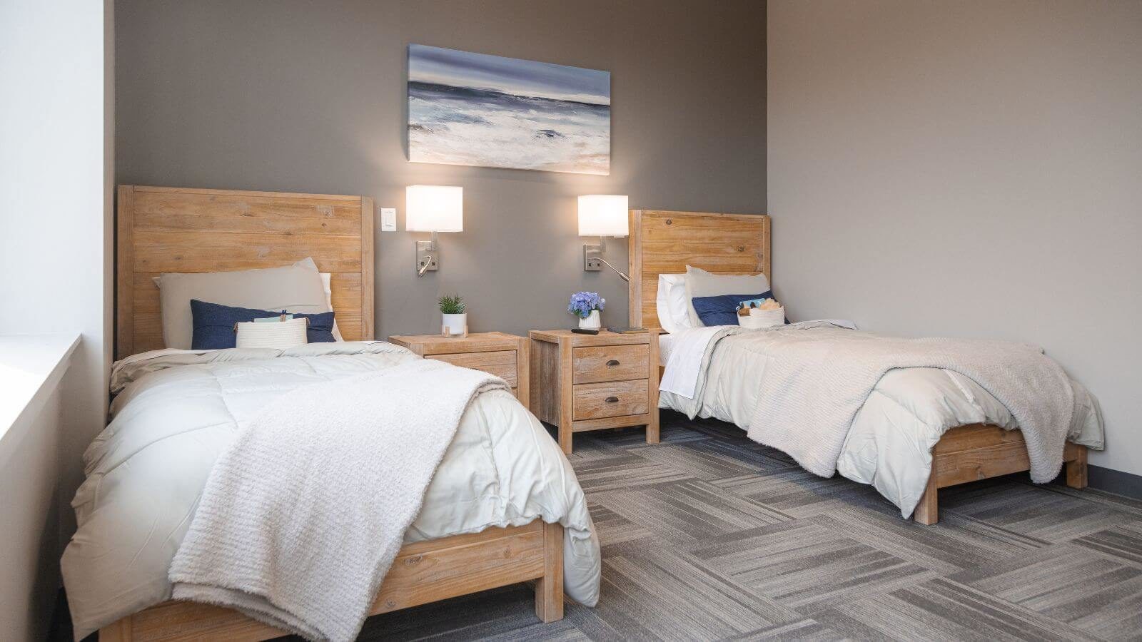 Sandstone Care Virginia Detox Center bedroom area with two beautiful bed with wooden frames