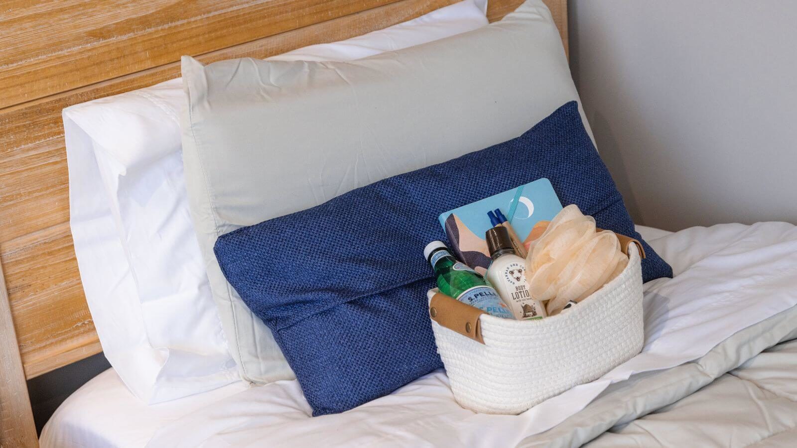 A box full of amenities on top of the bed at Sandstone Care Virginia Detox Center