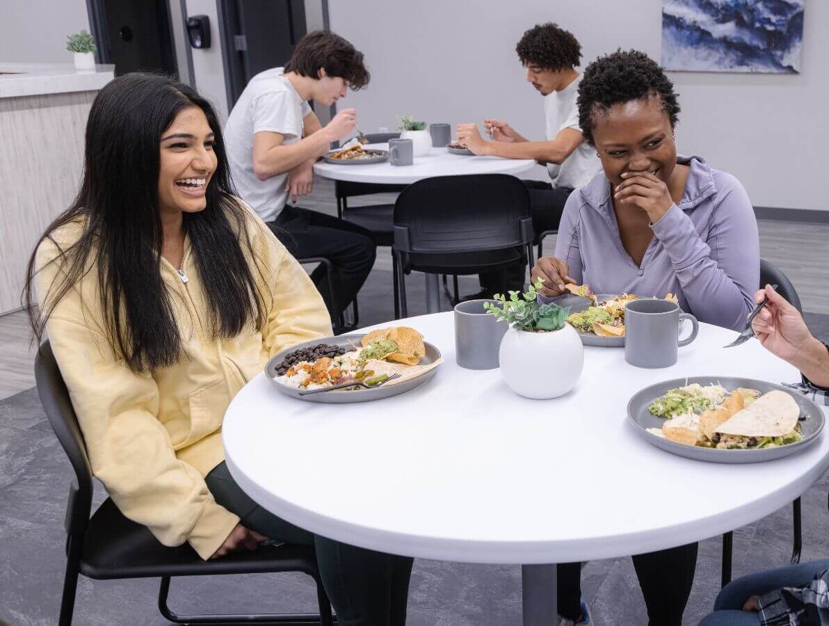 Clients at Sandstone Care Virginia Detox Center enjoying meal at the common area