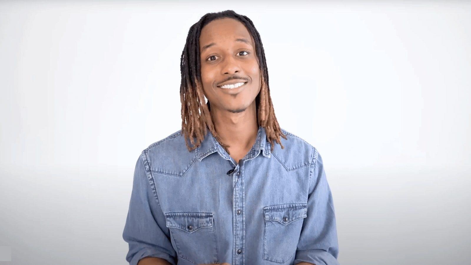 African American speaker explaining 4 signs of high functioning alcoholism in front of a white background